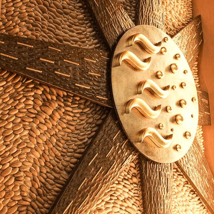 Interior wall sculpture with radial relief pattern